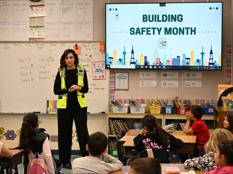 Community Outreach Assistant Tatiana Agopoglu speaks about building safety to a group of 2nd grade students at a local elementary school in 2025.​