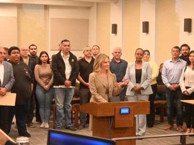 Women speaking at podium