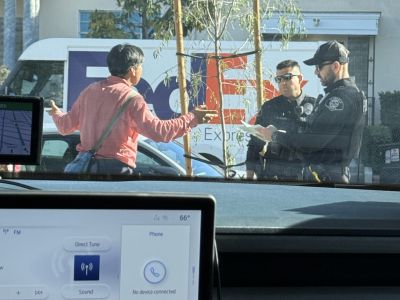 Two Glendale Police Officers speaking with a homeless individual during the 2026 Glendale Homeless Count.