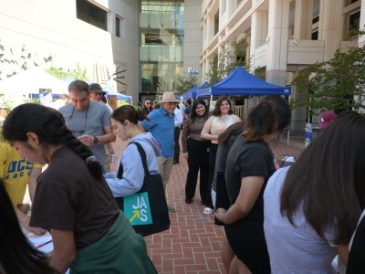 Building & Safety staff support local students participating in a building activity at the 2025 annual vendor fair at the Glendale Civic Center.