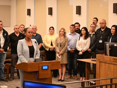 Women speaking at podium