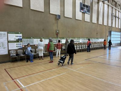 Community members engage with informational poster boards about the OSCR Elements update at Pacific Community Center.