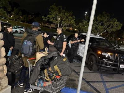 2026 Glendale Homeless Count volunteers and Glendale Police Officers contact a homeless individual during the evening count.