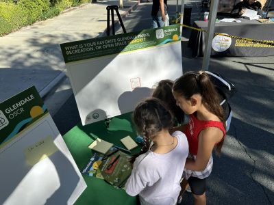 Local youth learn about the impact the OSCR Elements updates will have on how the community experiences parks, open space and recreation in Glendale during the Glendale Police Department Open House in 2025. 